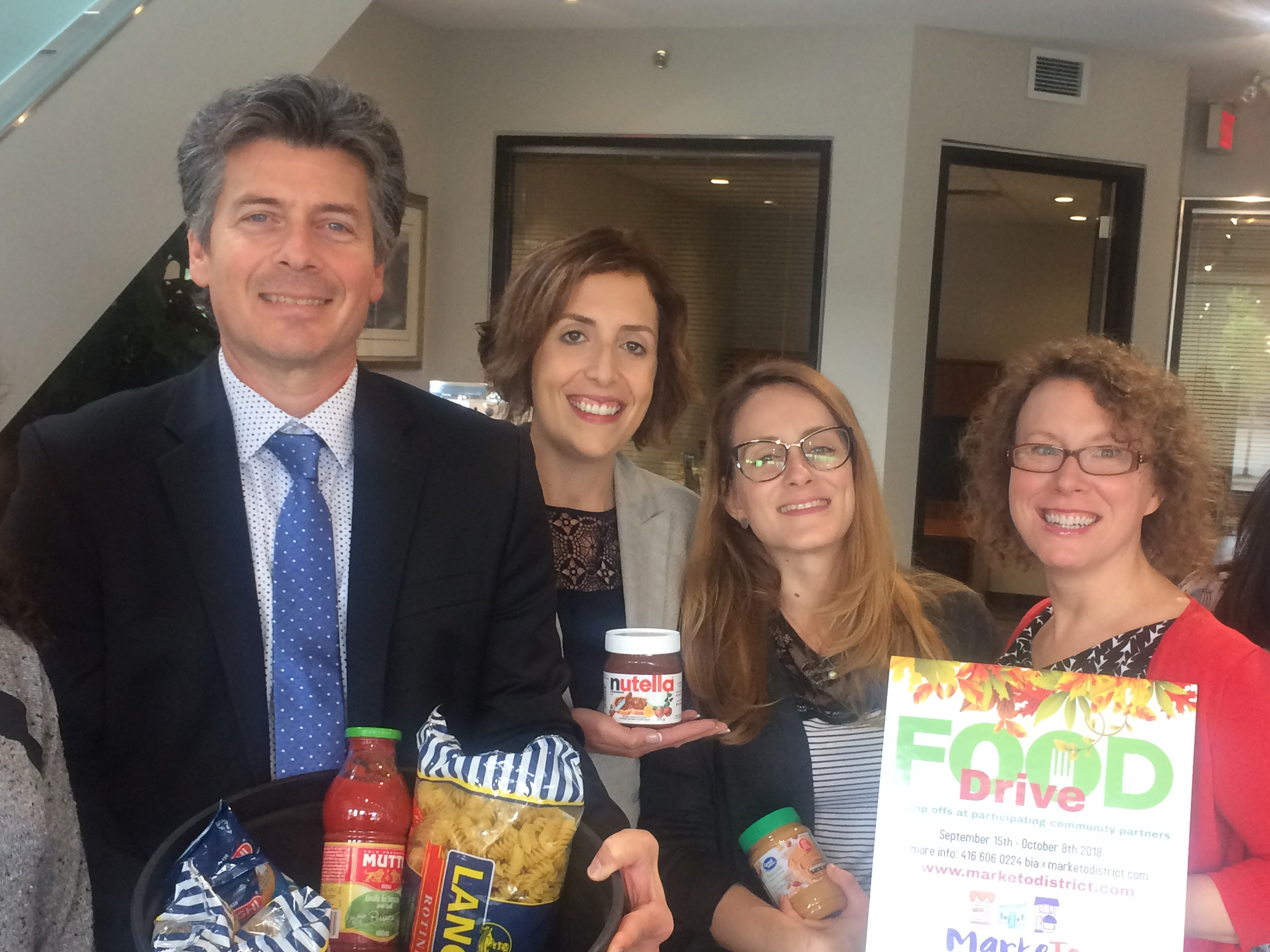 Branch staff with donations for fall food drive.