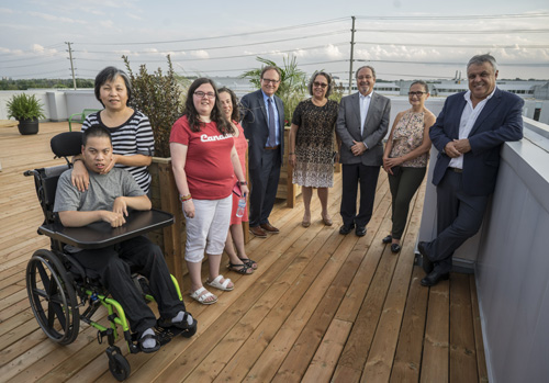 Clients and supporters gather on the MGI Financial Inc Rooftop Terrace.