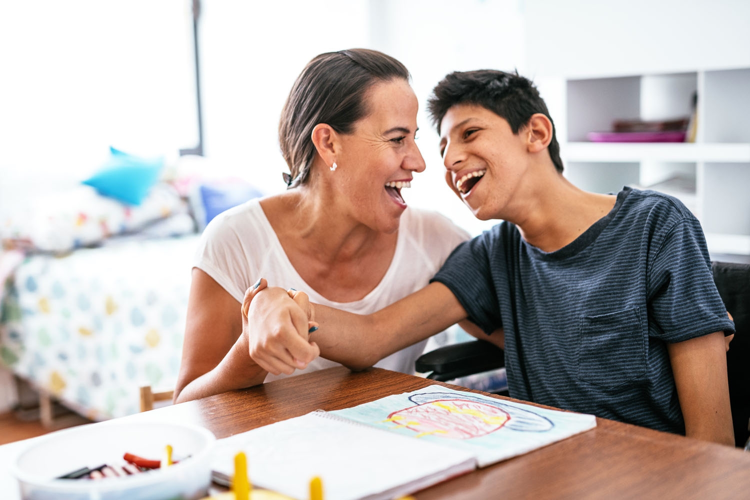 Mother and son share a joke.